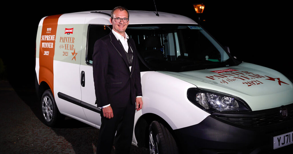 Man standing at side of van