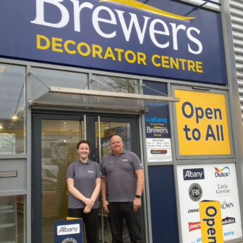 two people stood in front of brewers store